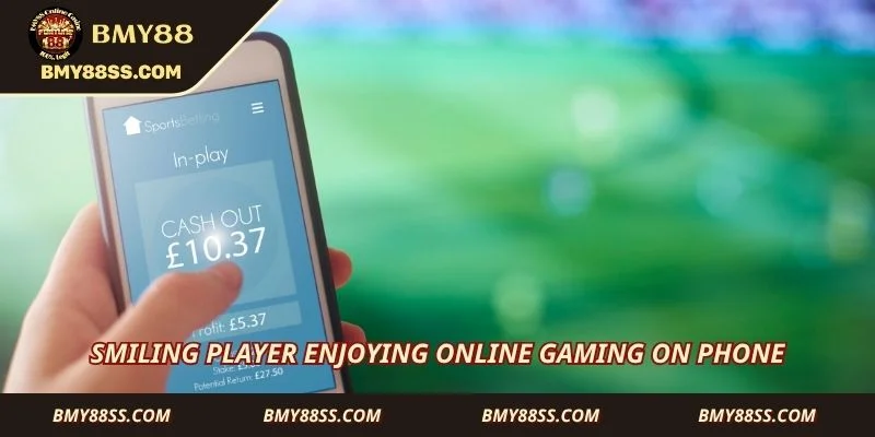 Smiling player enjoying online gaming on phone
